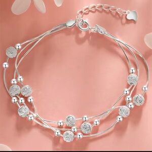 Elegant Silver Bracelet with Beaded Accents